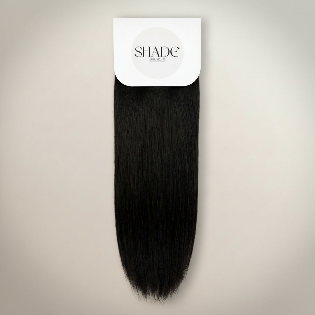 Black hair extension on a white background with 'SHADE' branding.