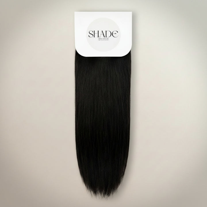 Black hair extension on a white background with 'SHADE' branding.